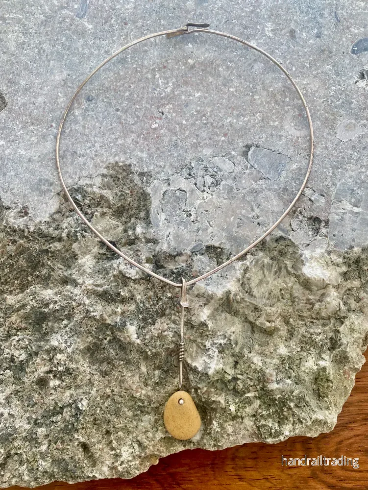 Vivianna Torun Bülow Hübe – Neckring with silver and natural stone pendant. Vivianna Torun Bülow Hübe – Neckring with silver and natural stone pendant.
